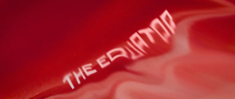 Soft red folds of fabric or cloud with the title blurring into them