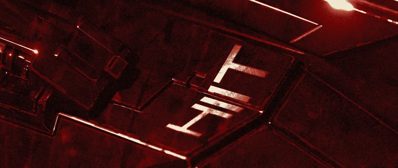 Red hull plating in raking light, the word HI1T stamped into the metal